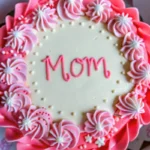 pink bento cake with “Mom” written in frosting
