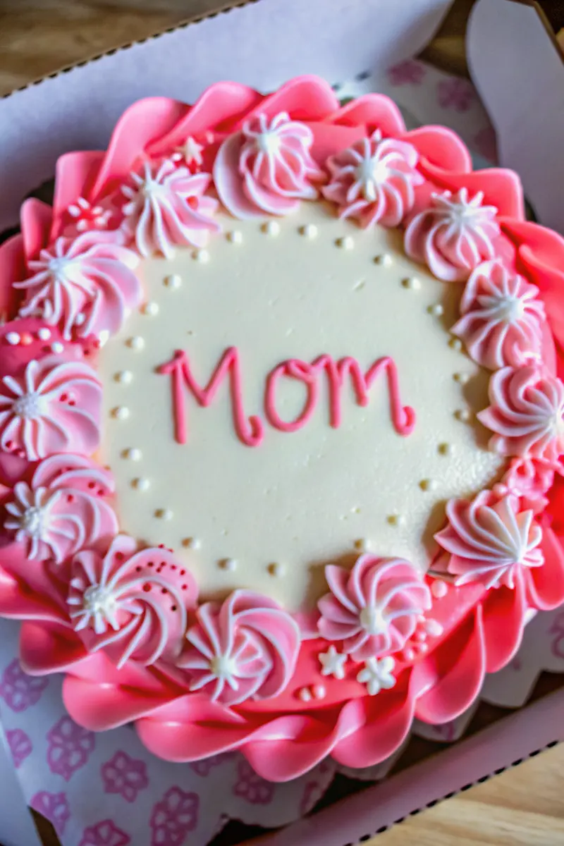 pink bento cake with “Mom” written in frosting