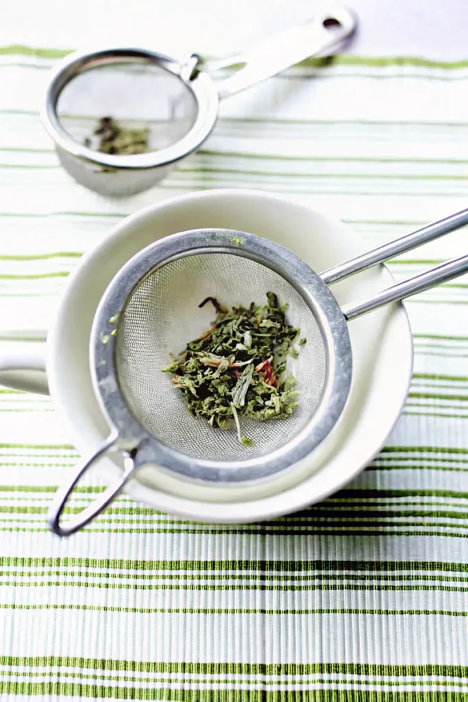 Loose-leaf green tea in strainer for coconut milk green tea recipe