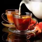 Hot strawberry milk tea with cinnamon and fresh strawberries