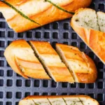 Frozen garlic bread in air fryer cooked golden and crispy in basket