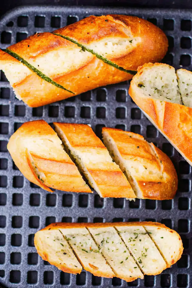 Frozen garlic bread in air fryer cooked golden and crispy in basket